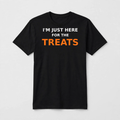 I'm Just Here for the Treats design on a black unisex t-shirt